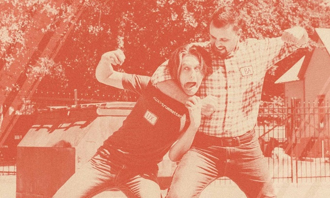 Two truematterians roleplaying as a business analyst and user experience play at fistfighting in a parking lot.