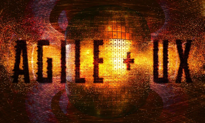 An image of a nuclear reactor with the overlaid text "AGILE UX.” There are yellow and red sparks of energy flying out of the reactor.